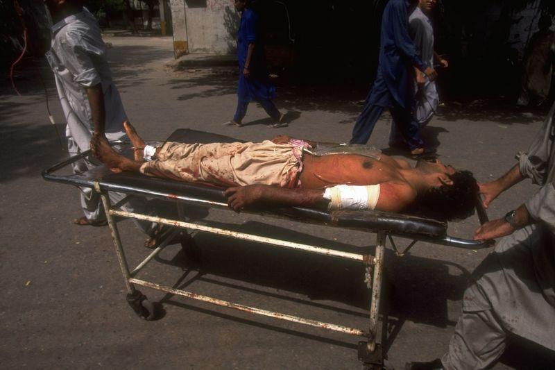 A civilian caught in the crossfire between the MQM and police in 1995. Photographer: Robert Nickelsberg/The Chronicle Collection/Getty Images