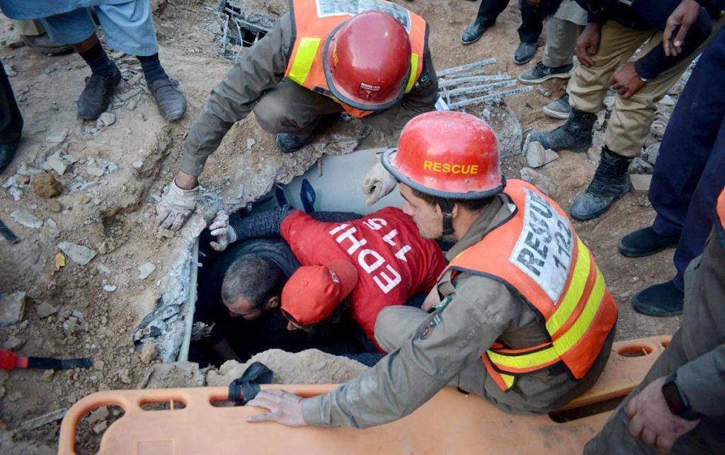  An injured is being evacuated from the collapsed roof of the mosque. APP/SYR/IQJ/FHA
