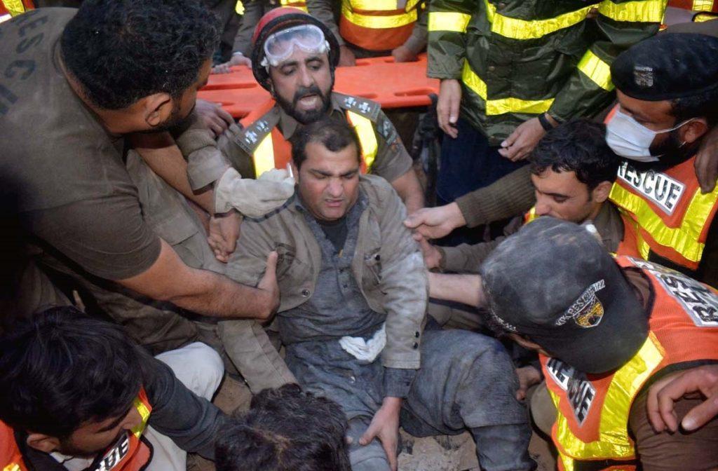 An injured is being evacuated from the collapsed roof of mosque. APP/SYR/IQJ/FHA