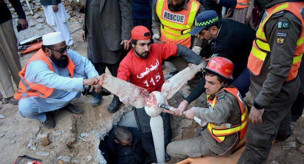 An injured is being evacuated from the collapsed roof of mosque. APP/SYR/IQJ/FHA
