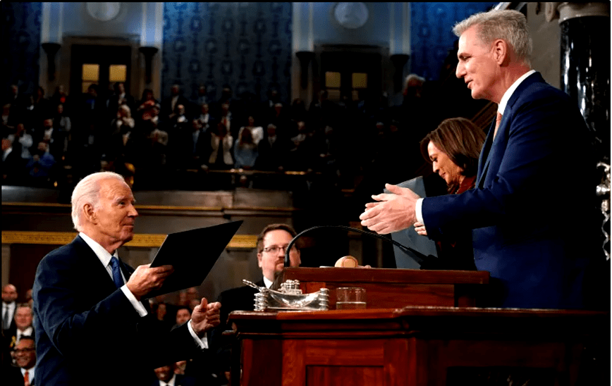 President Biden delivers a copy of his speech to House Speaker McCarthy on Feb 7