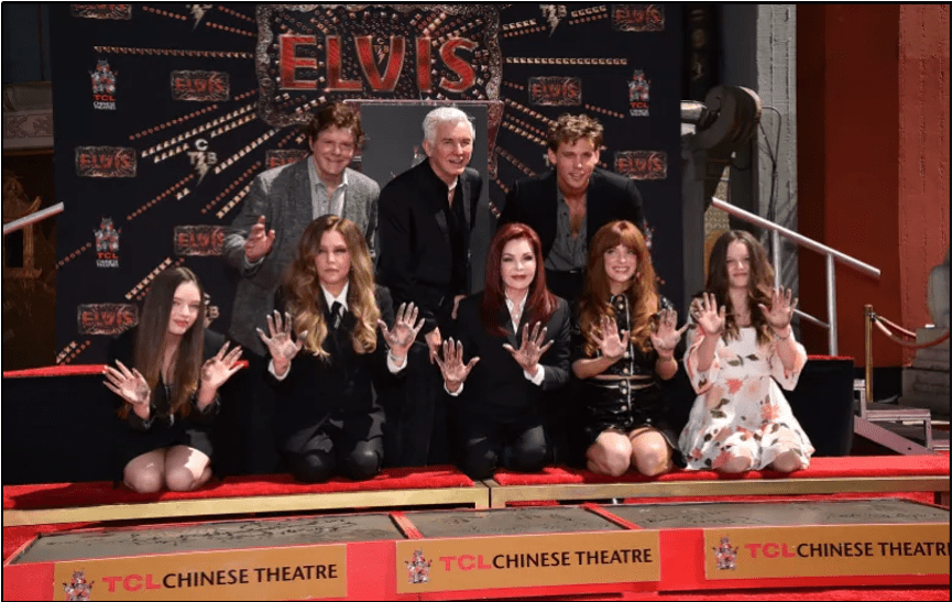 Director Baz Luhrmann (top centre) and actor Austin Butler (top right) pose with family members and colleagues of the late singer Elvis Presley