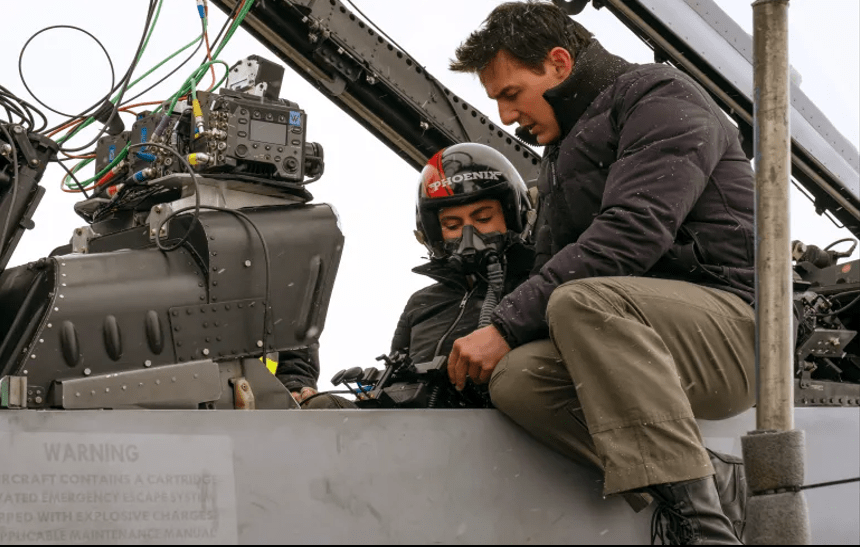 Monica Barbaro and Tom Cruise on the set of Top Gun: Maverick