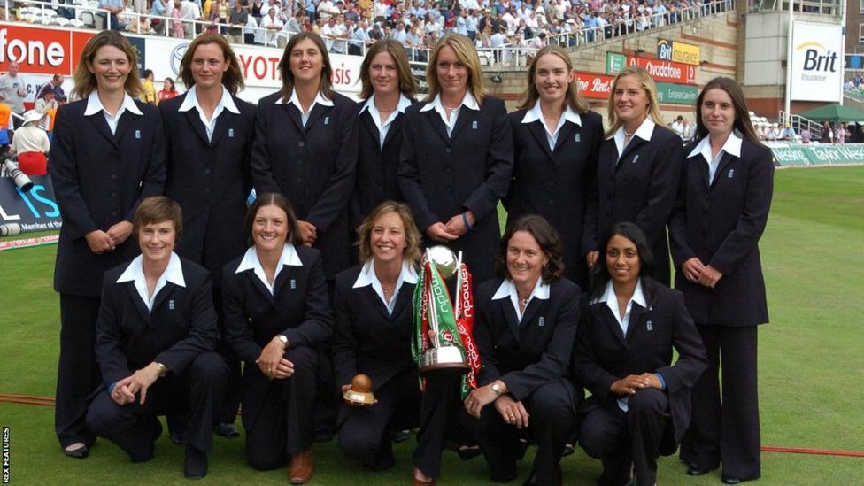 England's women pose with the Ashes trophy in their "feral" suits at tea during the men's fifth Test at the Oval
